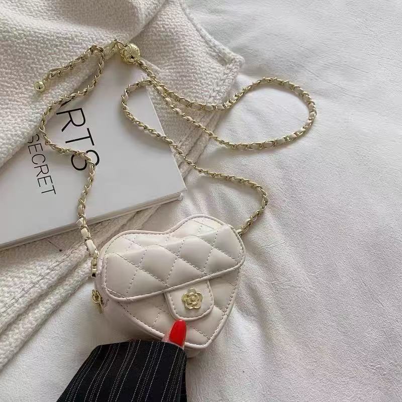 Amorette ivory quilted heart crossbody bag, close-up