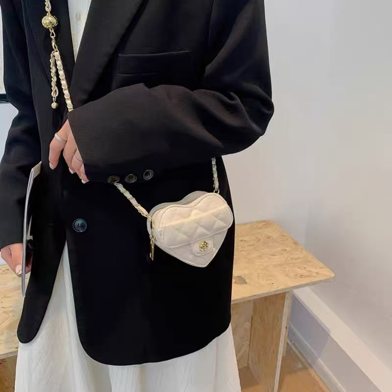 Amorette ivory heart bag, alternate on-body view
