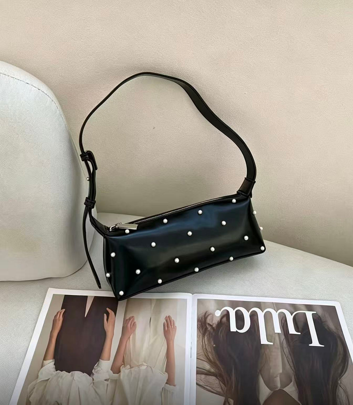 Lunette black pearl-accent shoulder bag, angled view