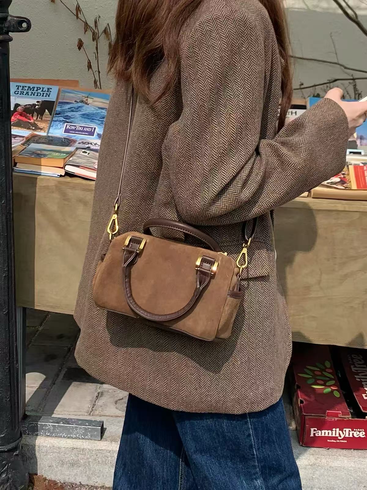 Marnie brown mini Boston bag worn on the shoulder